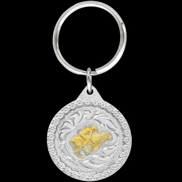 Celebrate the thrill of the rodeo with our Gold Mutton Bustin Keychain. Expertly crafted, it's a charming accessory for young rodeo fans and enthusiasts alike. Explore now and add a touch of Western excitement to your keychain collection!